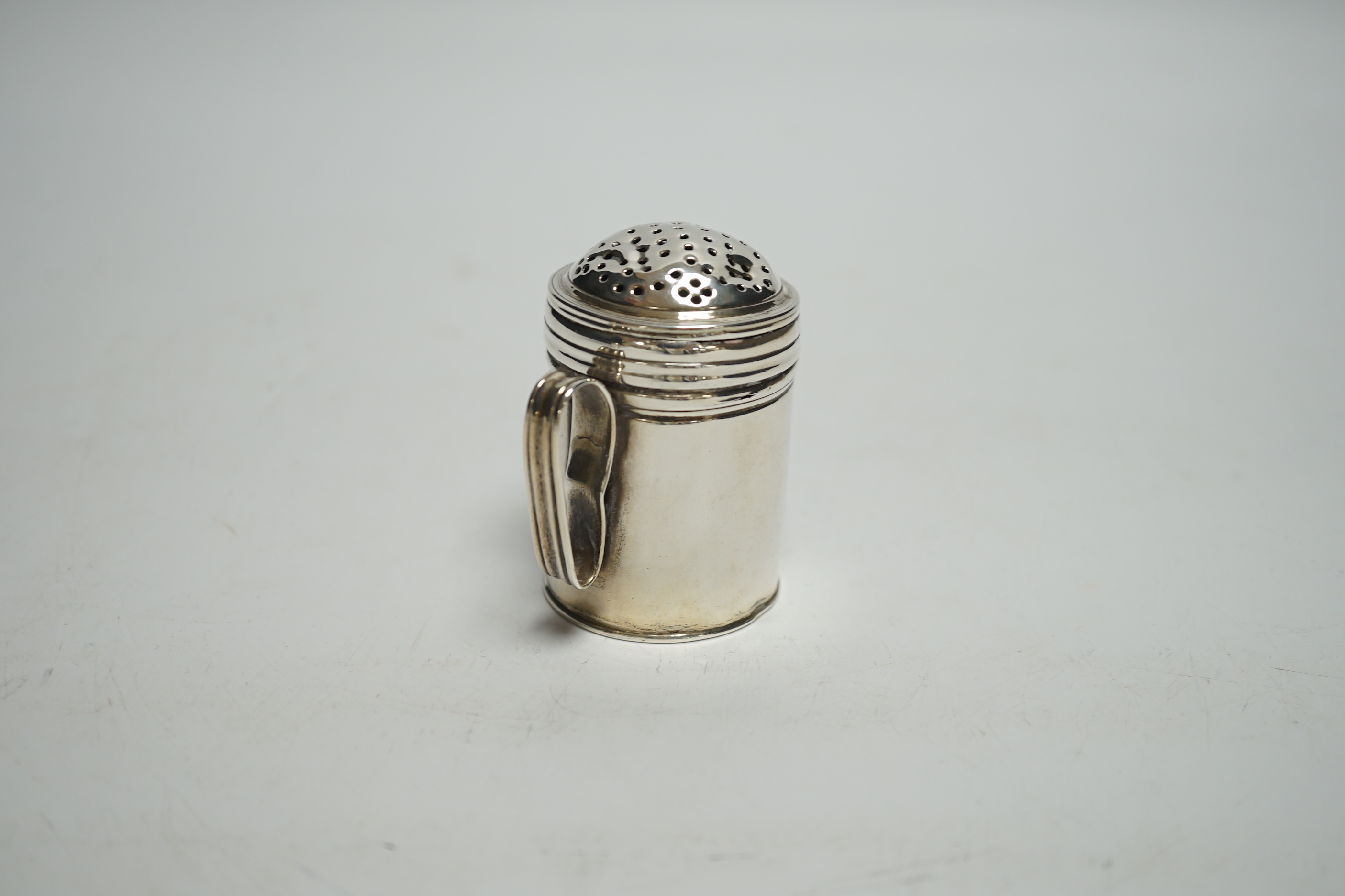 An early George III silver kitchen pepper, Richard Palmer I, London, 1767, 65mm, 68 grams.